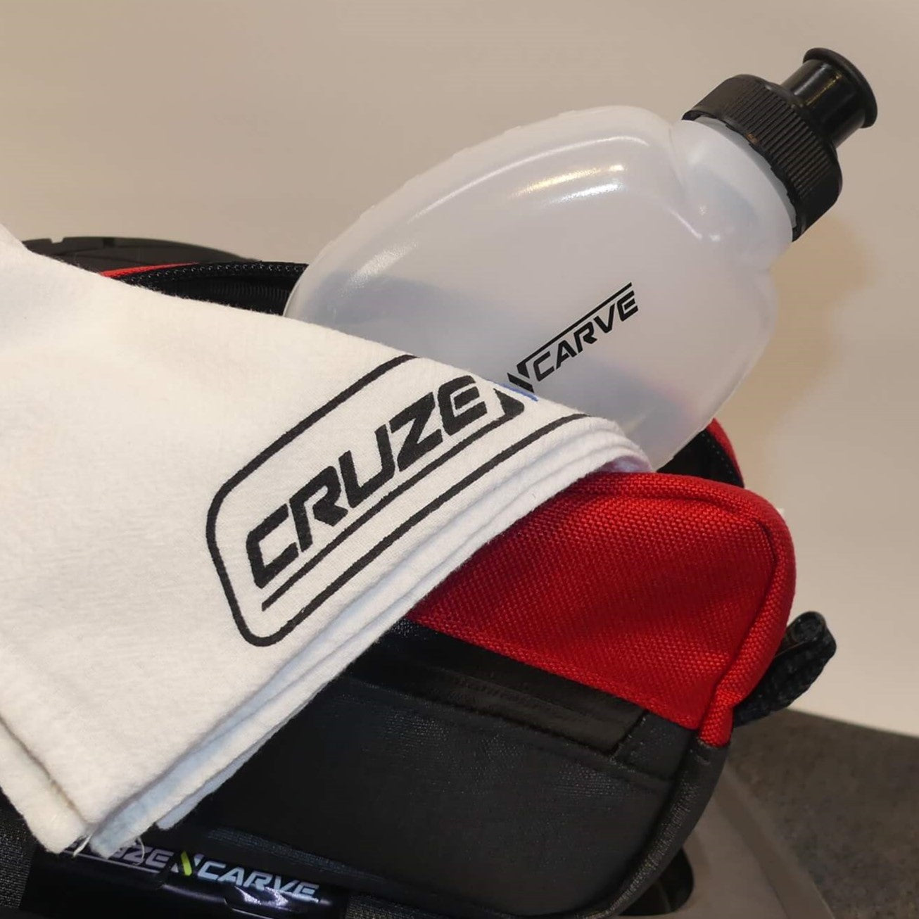 Small red colorado cruzer pack with towel and water bottle